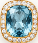 Aquamarine gemstone in an 18K gold setting with diamond halo